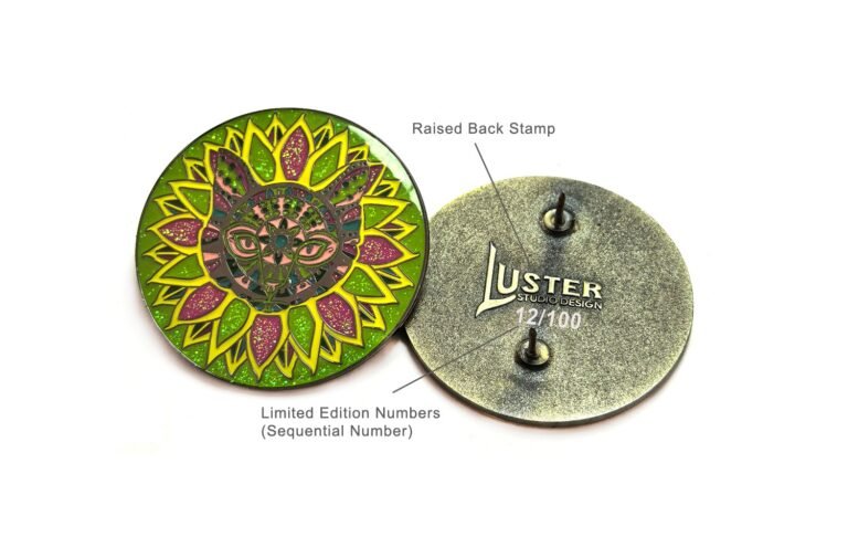 Close-up of enamel pins showing custom back stamps and sequential numbering