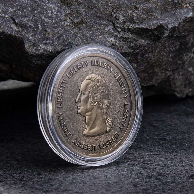 Custom challenge coins packaged in clear acrylic display cases for collectors
